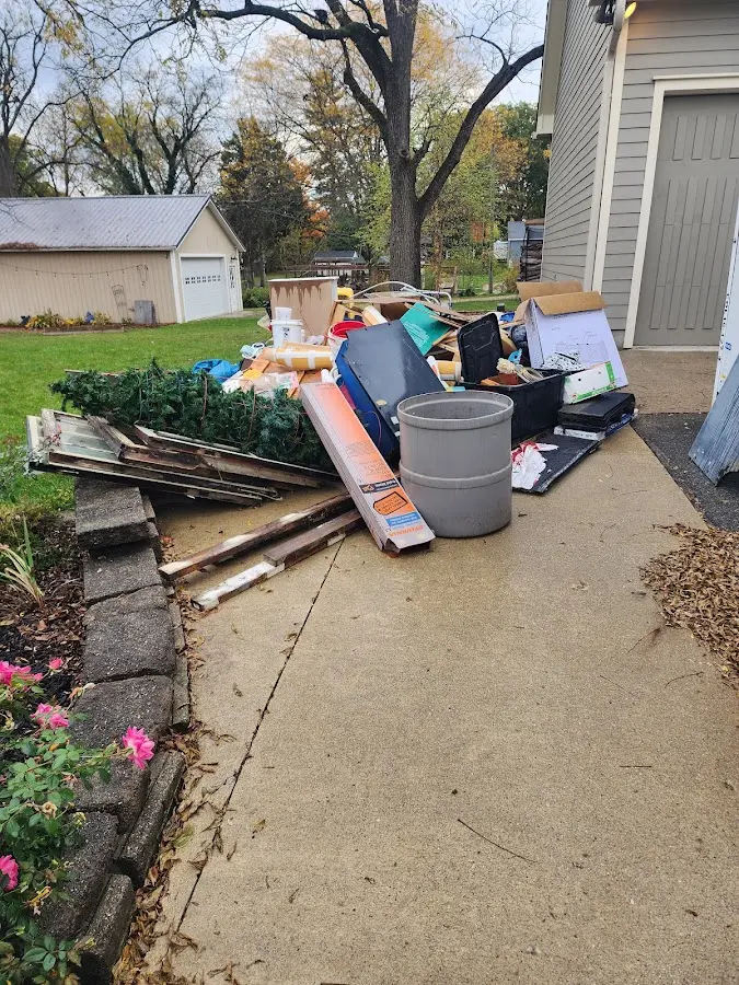 Dumpster being loaded with debris for 30 Yard Dumpster Rental in Canton